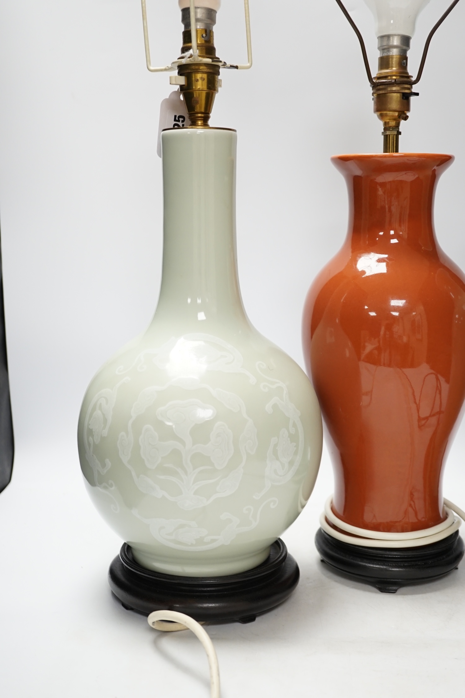 Three Chinese monochrome porcelain lamp bases, 20th century, tallest 38cm high